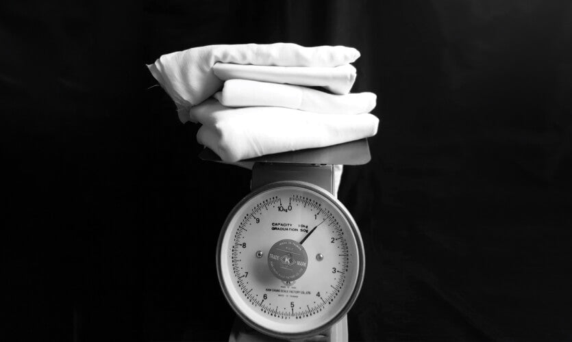 A scale with garments on it. 
